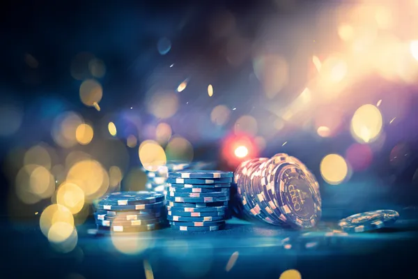 A glamorous woman holding casino chips in a neon-lit environment, representing the premium online casino atmosphere of JLWILD.