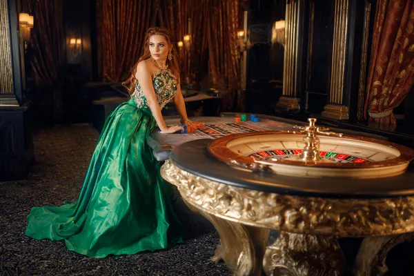 A person using their device against a moody casino-themed background, illustrating the smooth re-entry process at JLWILD.
